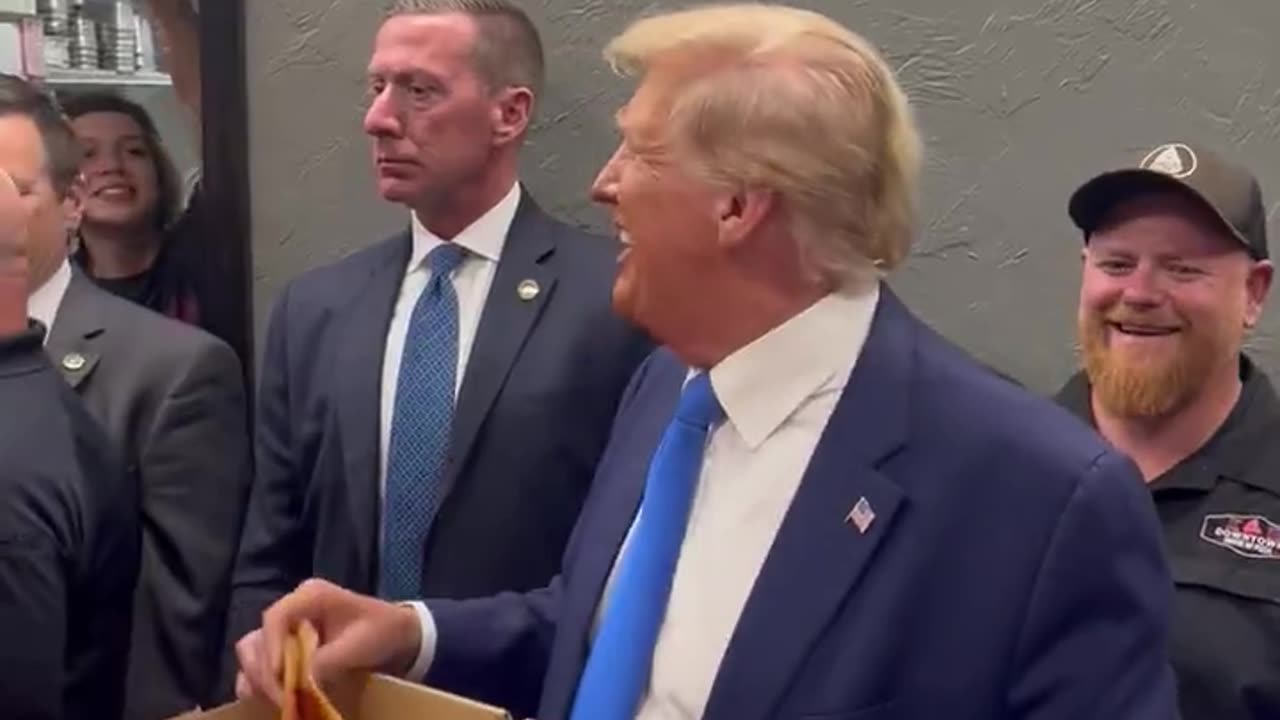Trump Shows Off His Charisma, Hands Out Pizza To Supporters