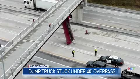 HIGHWAY 401 TRAFFIC CHAOS:DUMP TRUCK CONTAINERSTUCK UNDER OVERPASS