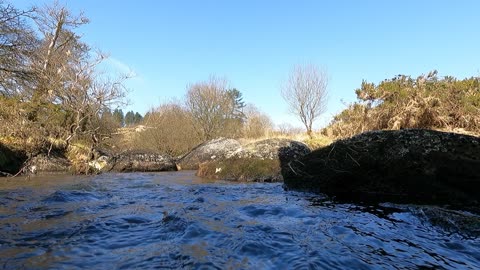 On top of the water of a river . GOPRO .