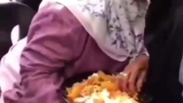 The touching moment when a mother feeds a child