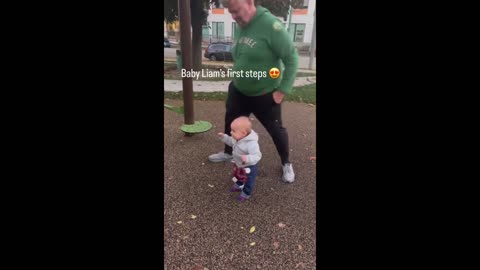 Mom unintentionally records the infant's first steps on camera.