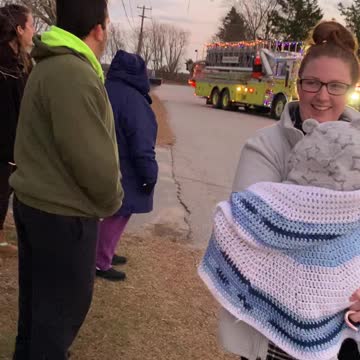 Santa is coming to town on a fire truck