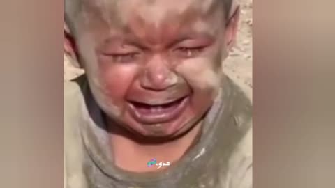 Palestinian child crying after Israeli bombardment.