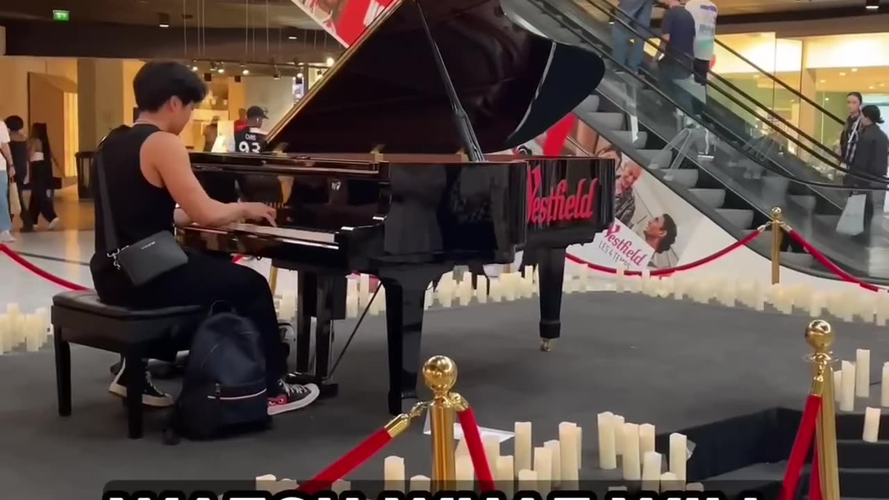 A Violinist appear on the escalators