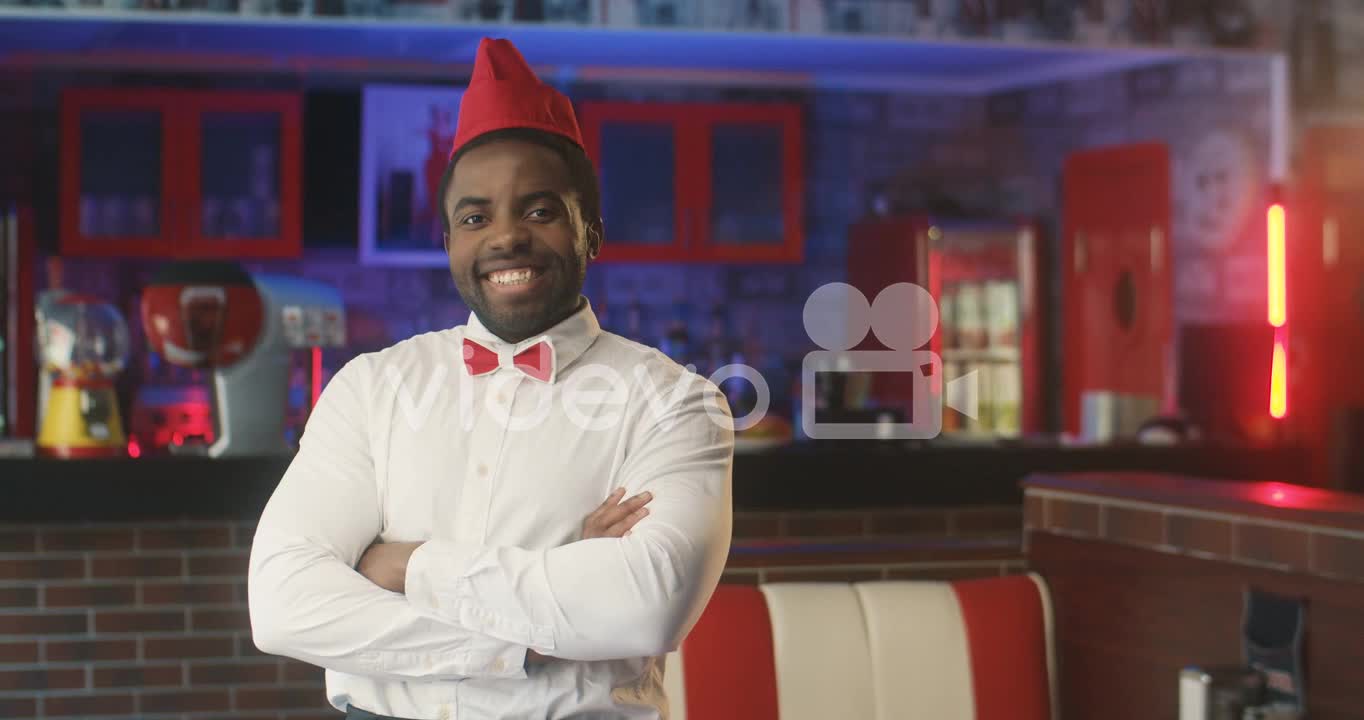 Waiter Smiling In A Typical American Diner