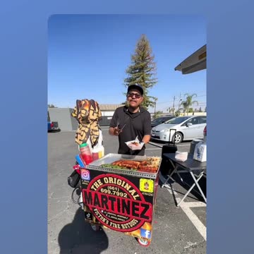 Sausage sandwich with various peppers from Martinez