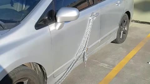 Car Secured With Lock and Chain