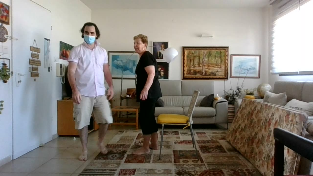 Teaching an un-limber woman how to rise from chair in 5 minutes - End result