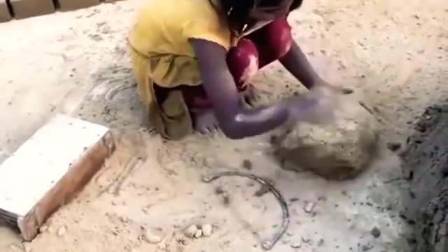 5 Years Old girl Making Bricks