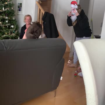 Katie with Santa Claus face and Mila