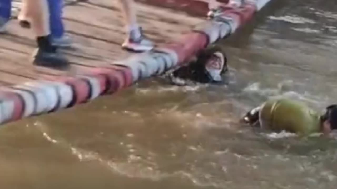 Journey of Giggles: Chinese Tourists Conquer the Wobbly Bridge