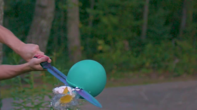 Watching water balloons in slow motion is amazing!