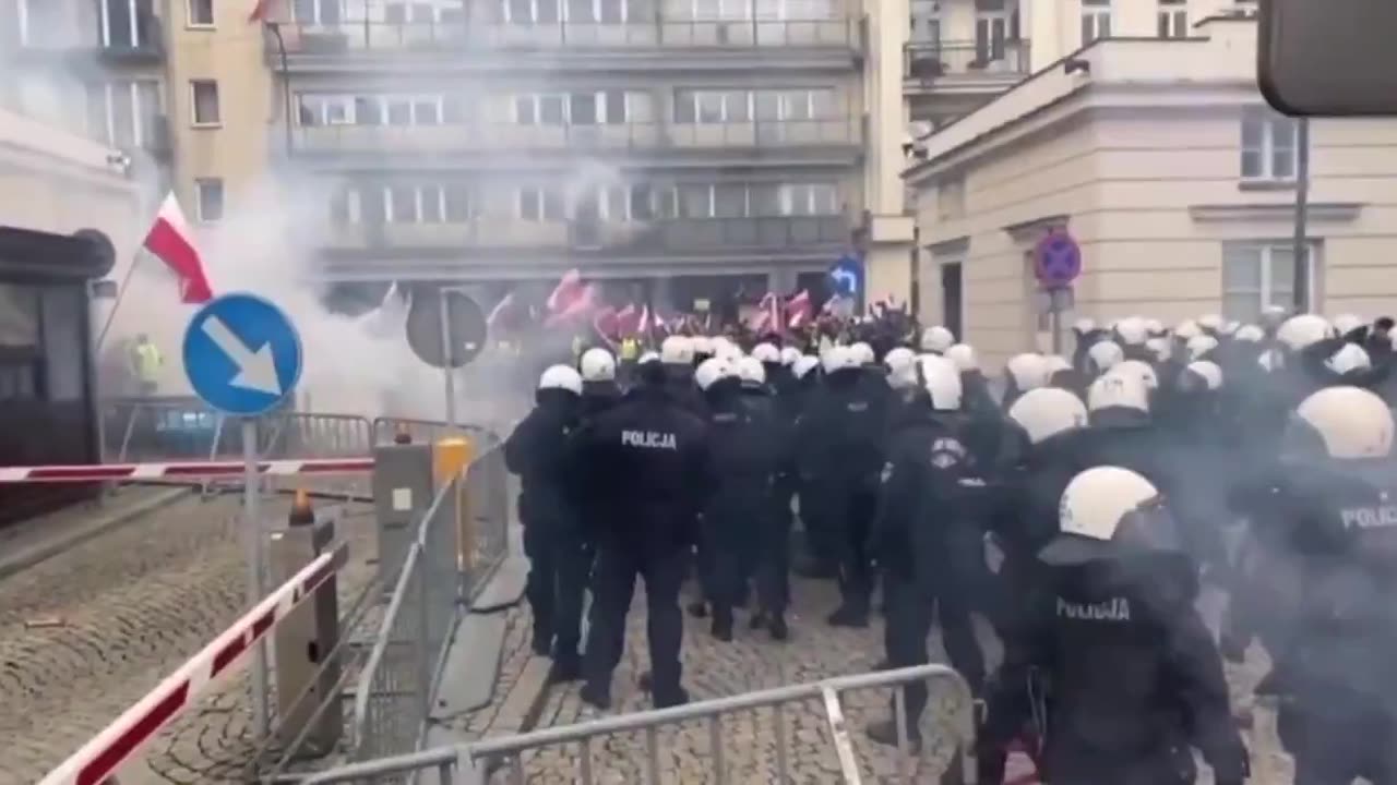 Police throw cobblestones at protesters.trying to provoke riots in our country?