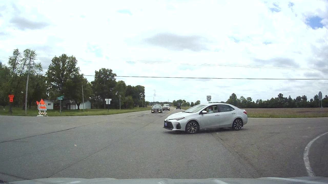 Driver Collides with Stop Sign Running Vehicle