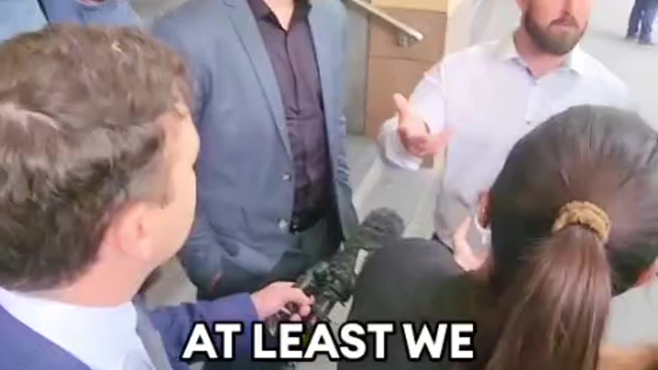 Thomas Sewell answers questions from reporters about arrest over protest Chinese consulate.