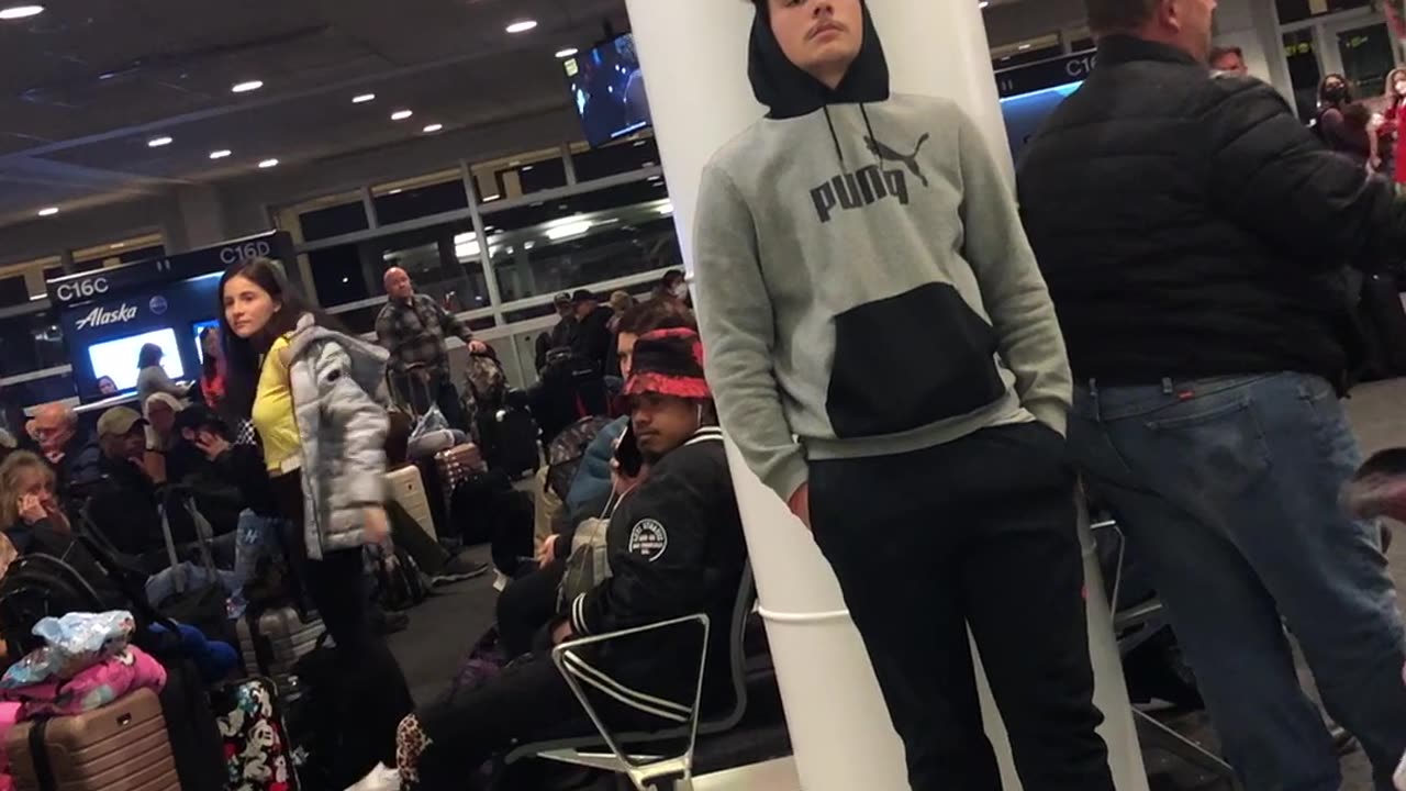 Man Creating a Scene at Seattle Airport Breaks into Song