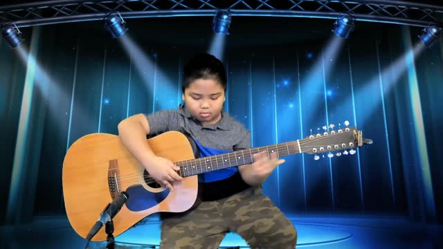 8-yr old Jeck Rox learning to play slide guitar