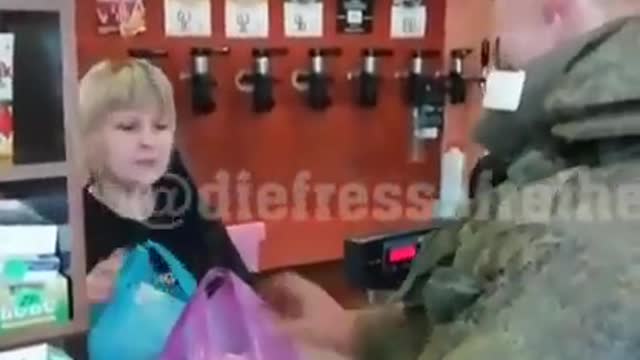 Ukrainian storekeeper refuses money from Russian soldier.