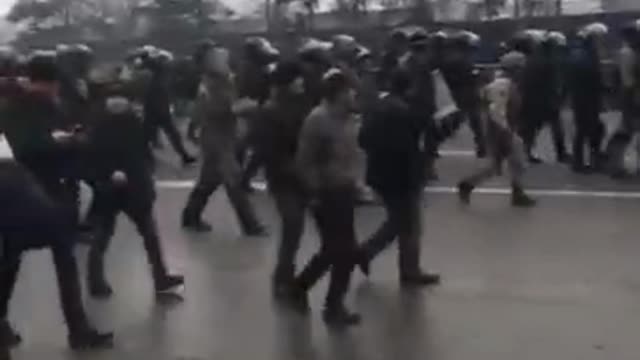 Police in Almaty leave their positions in Republic Square, where protesters took over the local