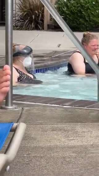 Double Masked woman sits in KIDDY POOL full of URINE
