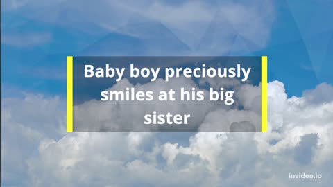 Baby boy preciously smiles at his big sister