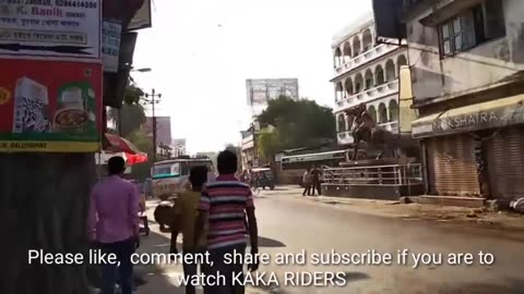 Bull fight on open town road and citizens' role _ Town Ox fight _ Busy road bull fight damages shop