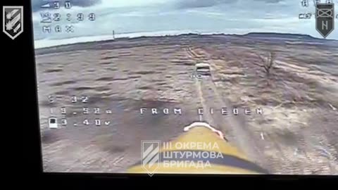 Ukrainians Fly a Drone Strait into the Back of a Russian Troop Carrier