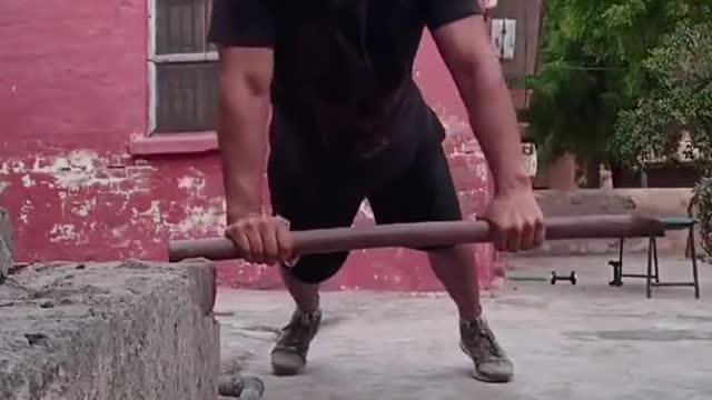 Guy Does Push-Ups While Balancing on Stick With Its One End in Air