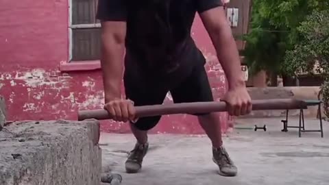 Guy Does Push-Ups While Balancing on Stick With Its One End in Air