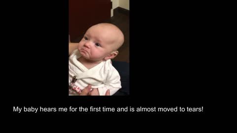 My baby hears me for the first time and is almost moved to tears!