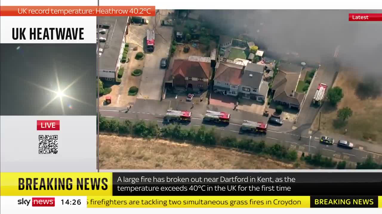 Houses ablaze as grass fire engulfs village outside London