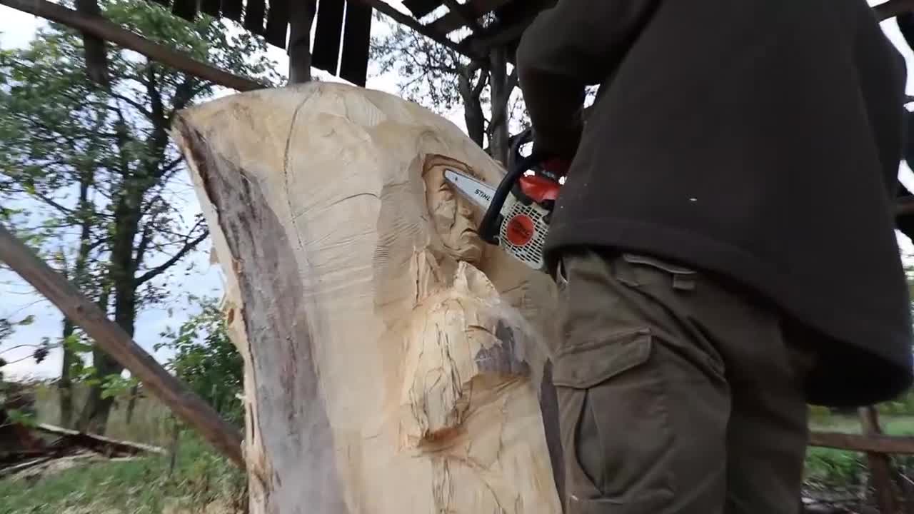 AMAZING CHAINSAW wood carving, Native American with wolves