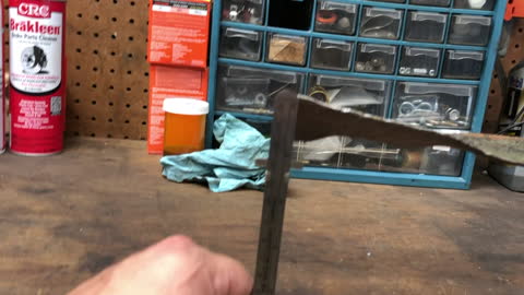 Straightening a bent mower blade