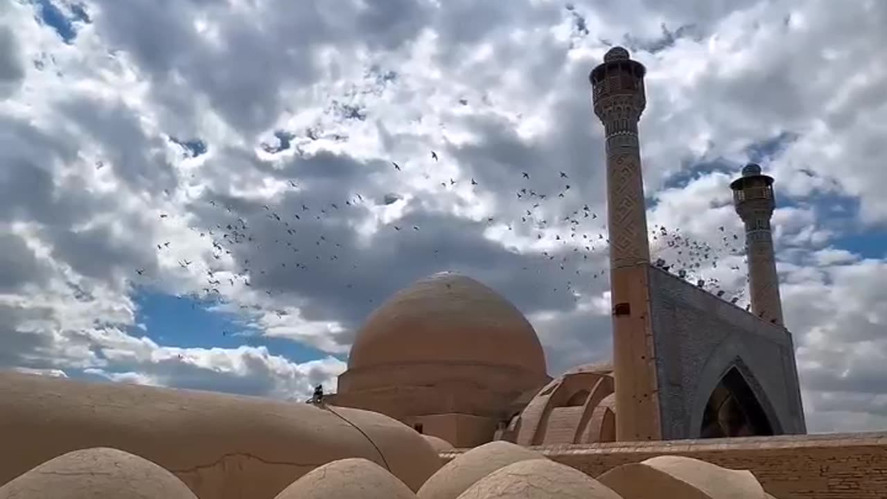 The flight of birds in the enchanting sky of Isfahan