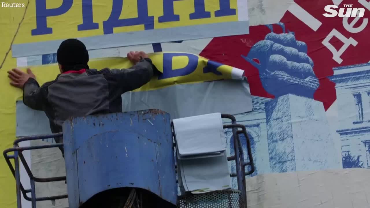 Ukrainians in Kherson rip down Russian propaganda billboards