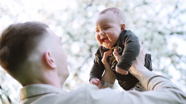 baby with dad laghing