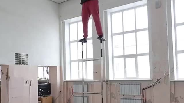 Guy Balances a Rose On His Forehead And Climbs Circus Ladder