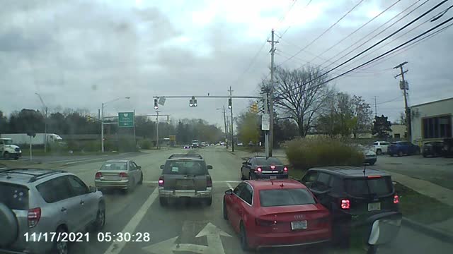 Car Squeezes Through Traffic During Police Chase