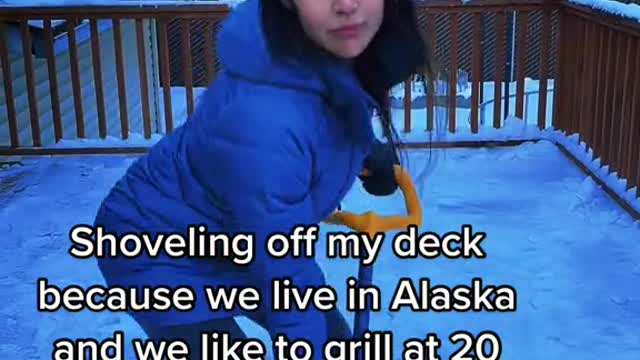 Shoveling off my deck because we live in Alaska and we like to grill at 20 below