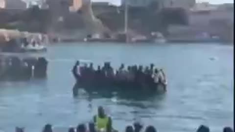 Lampedusa island, Italy. See all the women? Tell me this isn't a planned invasion.