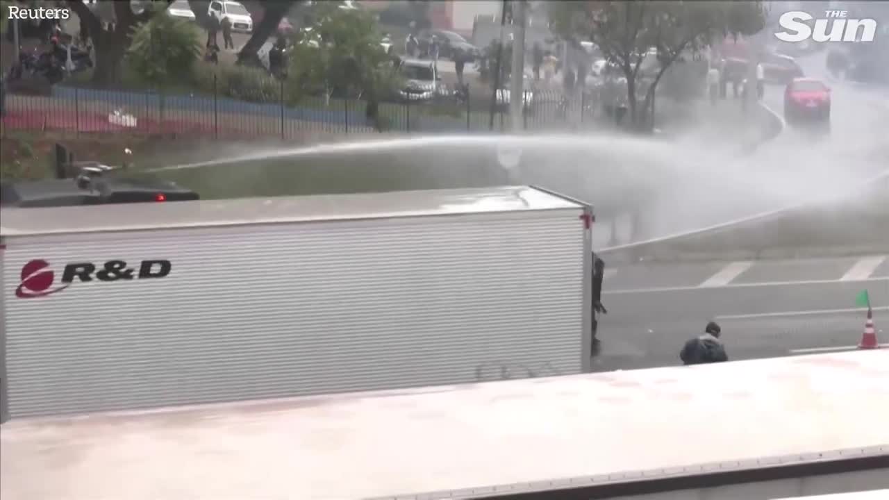 Brazilian police fire water cannons and rubber bullets at anti Lula protesters