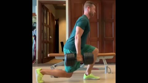 man exercising with a dumbbell