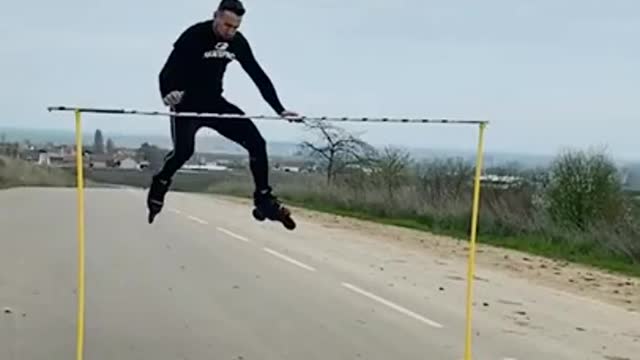 Guy Jumps Over Tall Horizontal Bar While Rollerskating