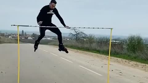 Guy Jumps Over Tall Horizontal Bar While Rollerskating