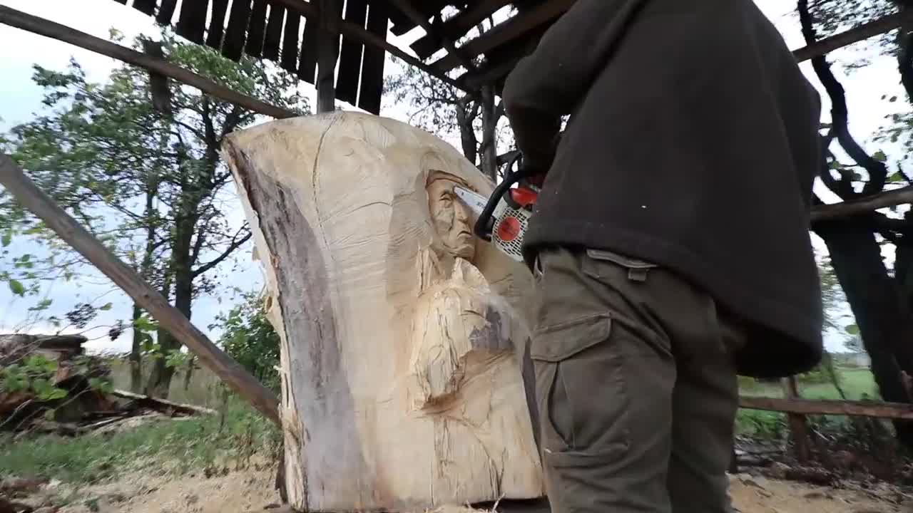 AMAZING CHAINSAW wood carving, Native American with wolves