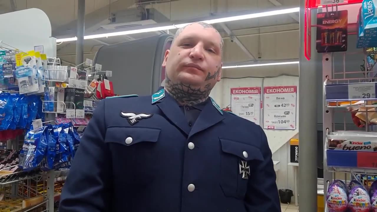 Artem Bonov, in Adolf Hitler's Luftwaffe uniform walking through a kyiv supermarket so quiet.