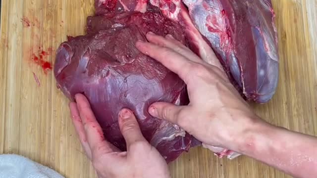 Butchering a deer hindquarter