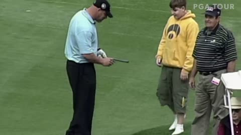 Wrestler Goldberg tosses fan in Water While playing golf.