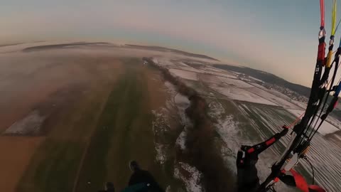 beautiful mix of fog and sunset on landing - Paramotor