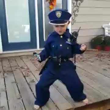 Tot Boy In Police Uniform Puts On Hilarious Dance Performance